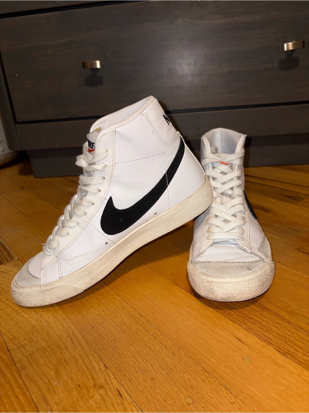 Nike White High-Top Sneakers with Black Swoosh